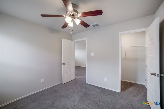 7147 Azure Waters, Converse, TX 78109 - unfurnished bedroom featuring carpet flooring, a walk in closet, a ceiling fan, and a closet