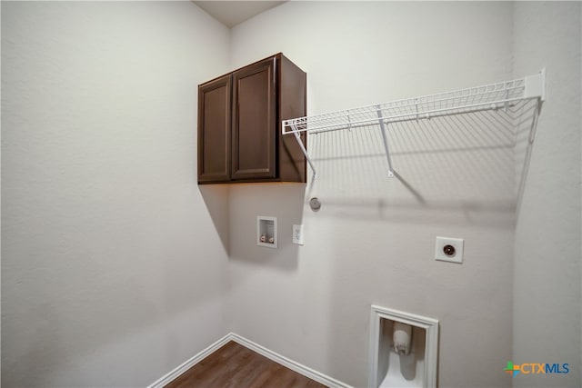 7147 Azure Waters, Converse, TX 78109 - laundry area featuring cabinet space, hookup for a washing machine, electric dryer hookup, and dark wood-type flooring