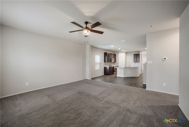 7147 Azure Waters, Converse, TX 78109 - unfurnished living room featuring dark colored carpet, a ceiling fan, and recessed lighting