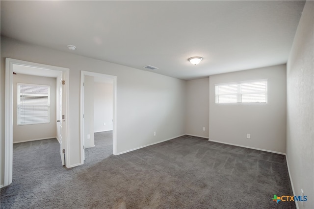 7147 Azure Waters, Converse, TX 78109 - spare room featuring dark colored carpet and a smoke detector