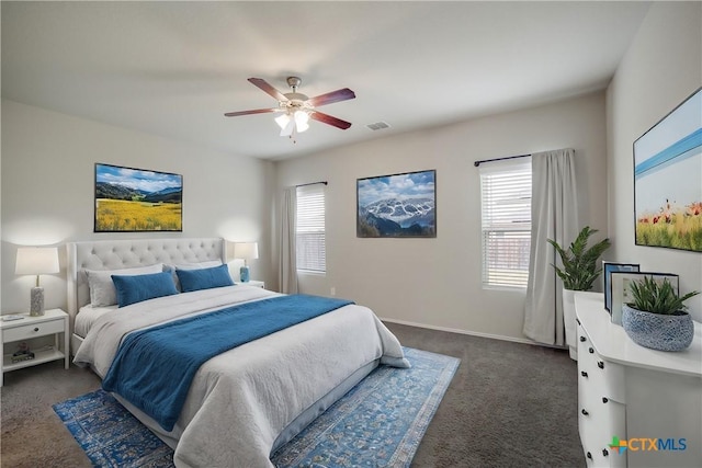 7147 Azure Waters, Converse, TX 78109 - bedroom featuring multiple windows, dark carpet, and ceiling fan