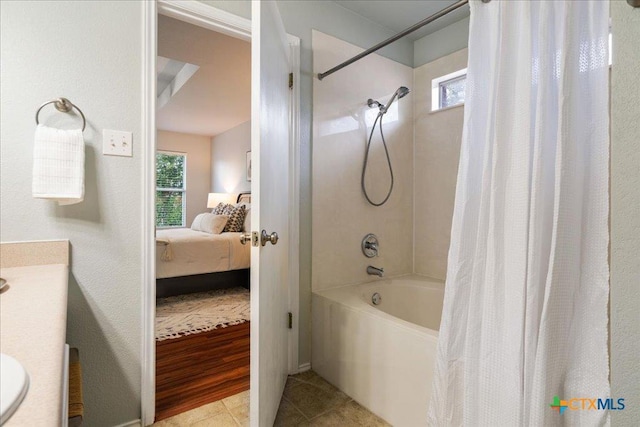 2102 Garrison Dr, Leander, TX 78641 - bathroom with shower / tub combo, connected bathroom, vanity, and tile patterned floors