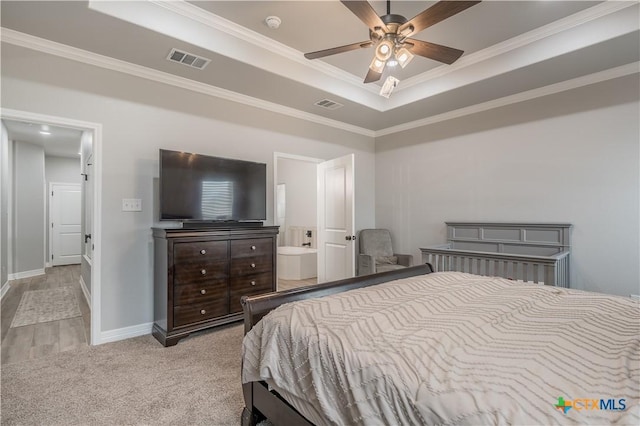 bedroom with light carpet, visible vents, a raised ceiling, and crown molding