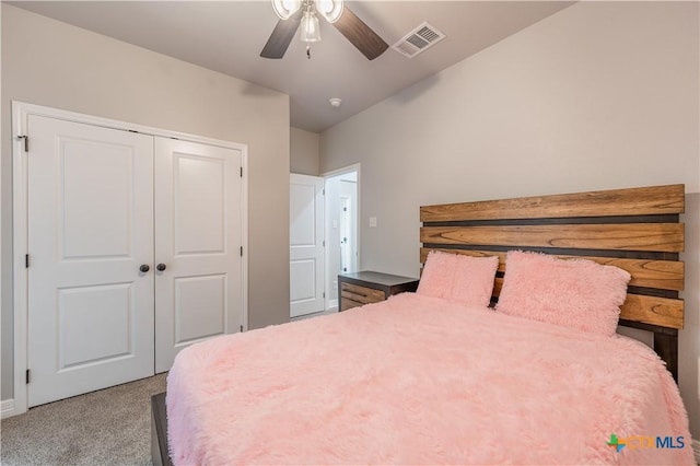 bedroom featuring carpet, a closet, visible vents, and ceiling fan