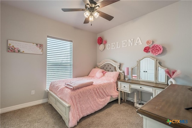 bedroom with light carpet, ceiling fan, and baseboards