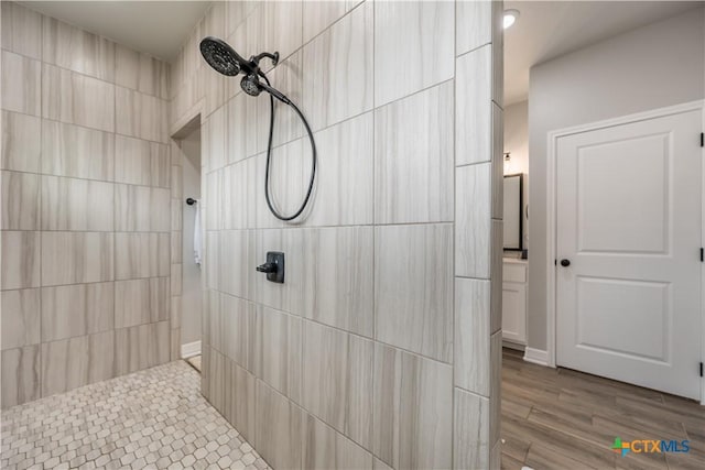 full bathroom with a tile shower