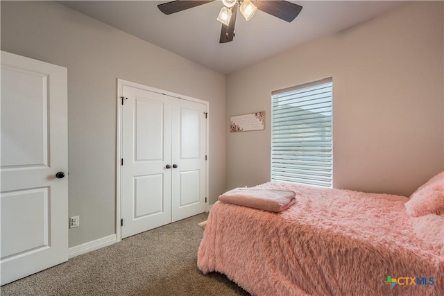 bedroom featuring ceiling fan, carpet, and baseboards