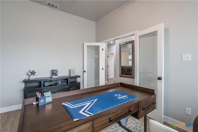 game room featuring baseboards, visible vents, and wood finished floors