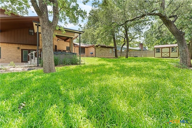 2106 Antelope Trl, Harker Heights, TX 76548 - view of yard featuring a storage unit, a hot tub, and a patio