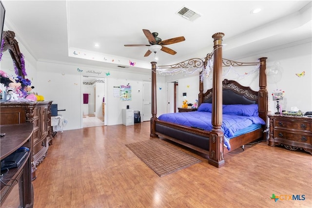 2106 Antelope Trl, Harker Heights, TX 76548 - bedroom featuring a tray ceiling, wood finished floors, crown molding, recessed lighting, and a ceiling fan