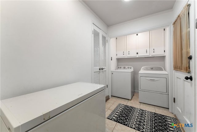 2106 Antelope Trl, Harker Heights, TX 76548 - washroom featuring washer and clothes dryer, cabinet space, ornamental molding, and light tile patterned floors