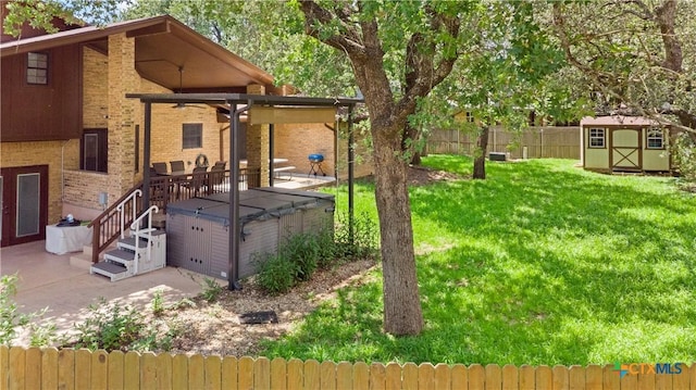 2106 Antelope Trl, Harker Heights, TX 76548 - fenced backyard with a hot tub, a shed, a patio, and a ceiling fan