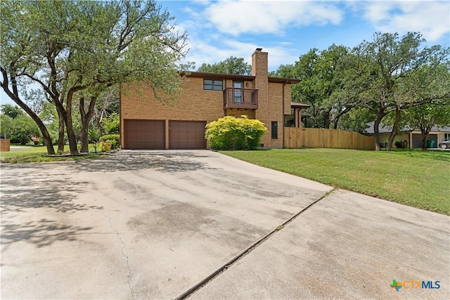 2106 Antelope Trl, Harker Heights, TX 76548 - view of front of house featuring a balcony, concrete driveway, a chimney, an attached garage, and brick siding