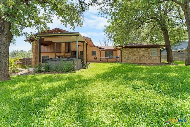 2106 Antelope Trl, Harker Heights, TX 76548 - rear view of property featuring a hot tub and brick siding