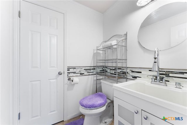 2106 Antelope Trl, Harker Heights, TX 76548 - bathroom featuring vanity, crown molding, and decorative backsplash