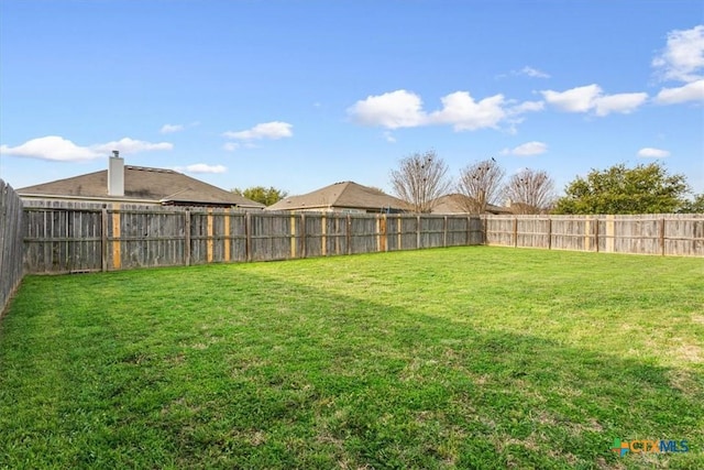 view of yard featuring a fenced backyard