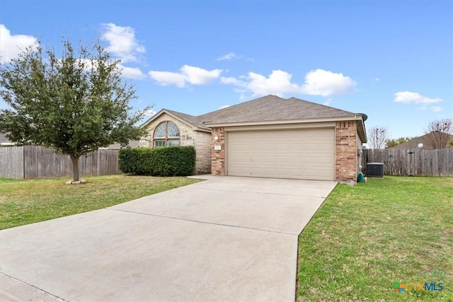 single story home featuring an attached garage, brick siding, a front lawn, and concrete driveway