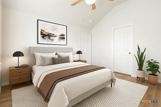 bedroom with vaulted ceiling, baseboards, light wood-style floors, ceiling fan, and visible vents
