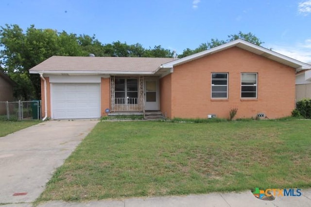 1007 E Robertson Ave, Copperas Cove, TX 76522 - ranch-style home featuring an attached garage, driveway, and brick siding