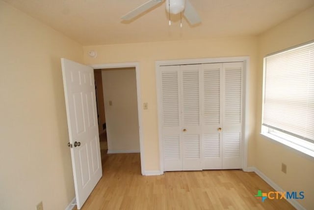 1007 E Robertson Ave, Copperas Cove, TX 76522 - unfurnished bedroom with light wood finished floors, baseboards, a closet, and ceiling fan