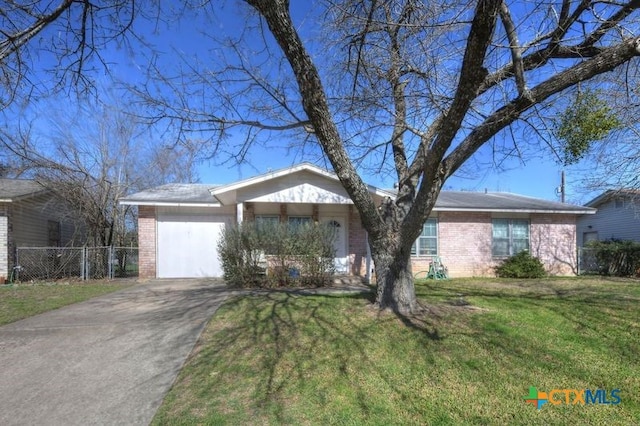 ranch-style house featuring a garage, brick siding, a front lawn, and fence