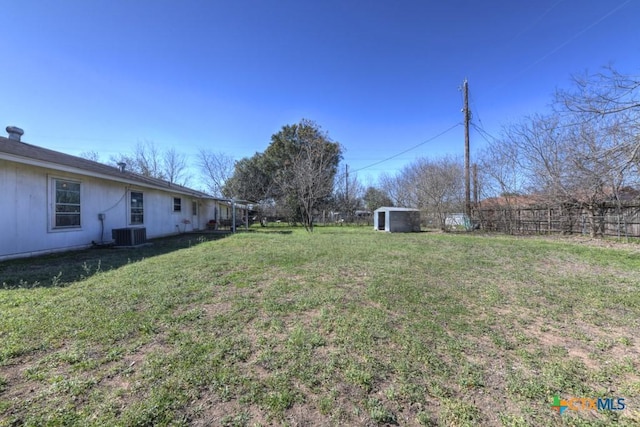 1541 Cologne Dr, New Braunfels, TX 78130 - view of yard featuring a fenced backyard, an outdoor structure, a shed, and central AC unit