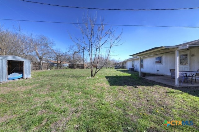 view of yard featuring a patio area and fence