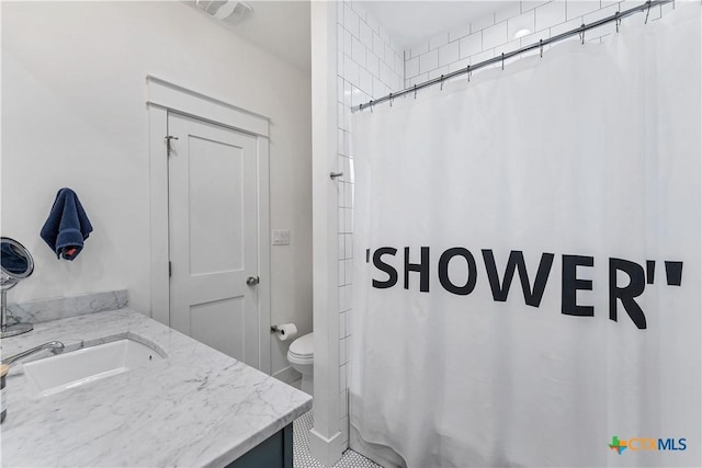 bathroom featuring walk in shower, vanity, and toilet