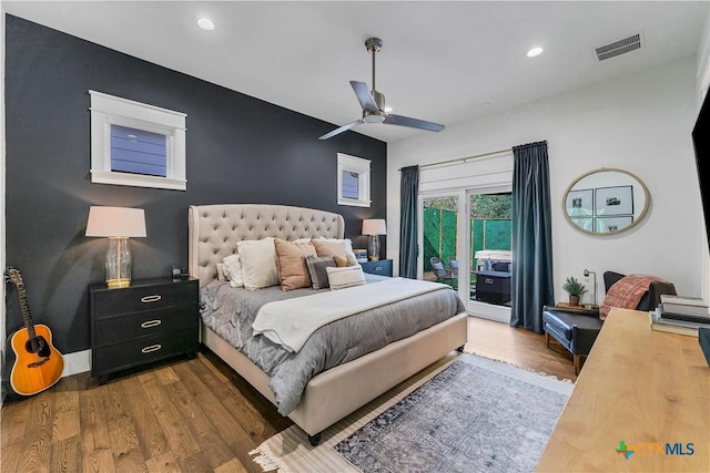 bedroom with dark hardwood / wood-style floors, ceiling fan, and access to exterior