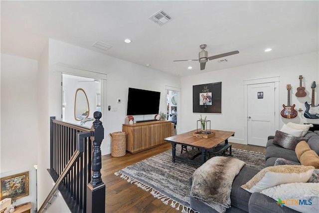 living room with ceiling fan and wood-type flooring