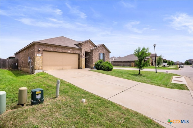 single story home with a front lawn, concrete driveway, brick siding, and a garage