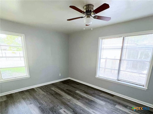 1818 Travis Ave, Victoria, TX 77901 - unfurnished room with plenty of natural light, dark wood finished floors, and a ceiling fan