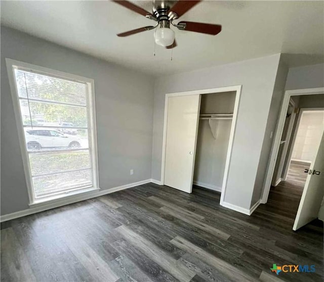 1818 Travis Ave, Victoria, TX 77901 - unfurnished bedroom featuring dark wood-style flooring, a closet, and a ceiling fan