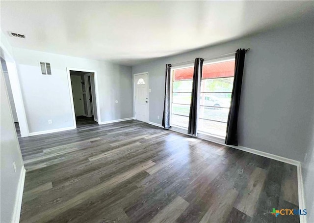 1818 Travis Ave, Victoria, TX 77901 - unfurnished room featuring dark wood-type flooring