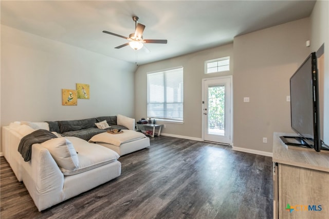 living room with dark hardwood / wood-style floors and ceiling fan