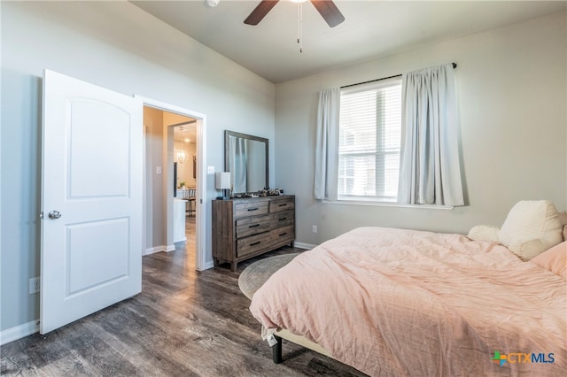 bedroom featuring dark hardwood / wood-style flooring and ceiling fan