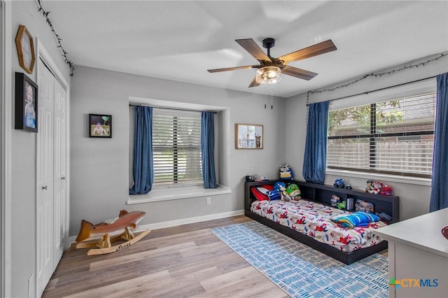 119 Larimore St, Victoria, TX 77904 - bedroom with wood finished floors, baseboards, a closet, and a ceiling fan
