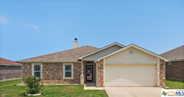 single story home featuring a garage and a front yard