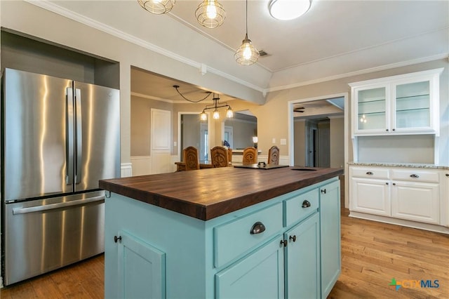 13230 Harvest Hill Ln, Holland, TX 76534 - kitchen featuring blue cabinets, butcher block counters, white cabinetry, stainless steel fridge, and a kitchen island