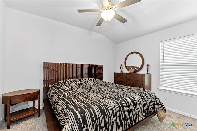 carpeted bedroom with ceiling fan and lofted ceiling