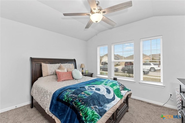 carpeted bedroom featuring ceiling fan, lofted ceiling, and multiple windows