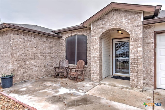 doorway to property featuring a patio