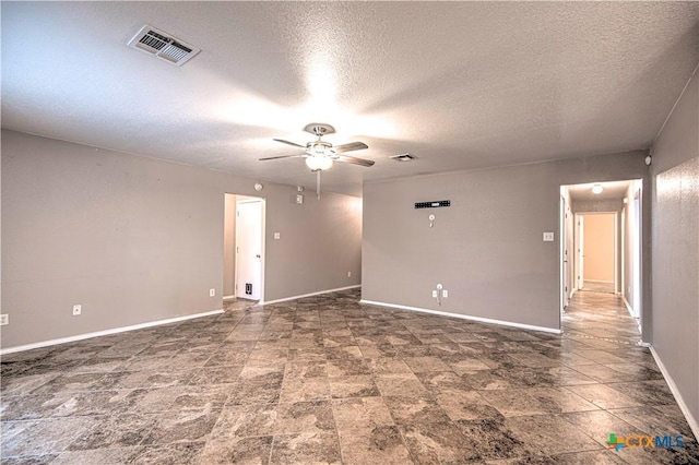 unfurnished room with a textured ceiling and ceiling fan