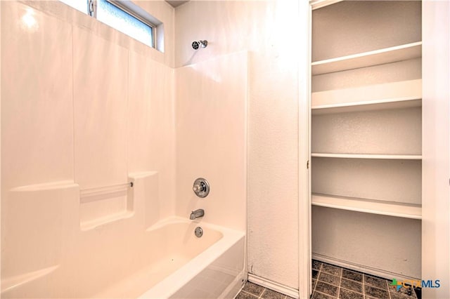 bathroom with bathing tub / shower combination