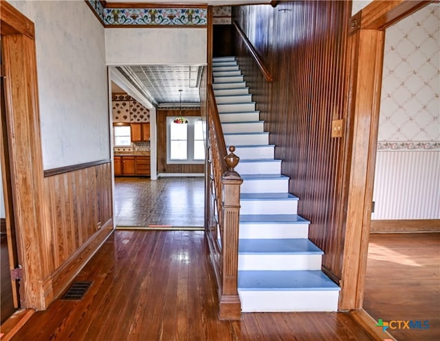 staircase featuring hardwood / wood-style flooring