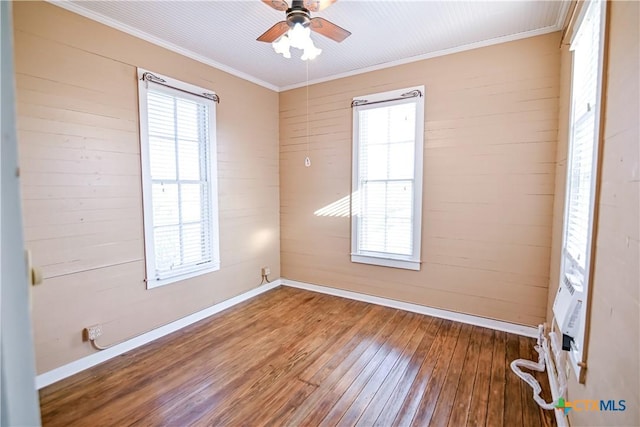 unfurnished room with crown molding, hardwood / wood-style floors, and ceiling fan