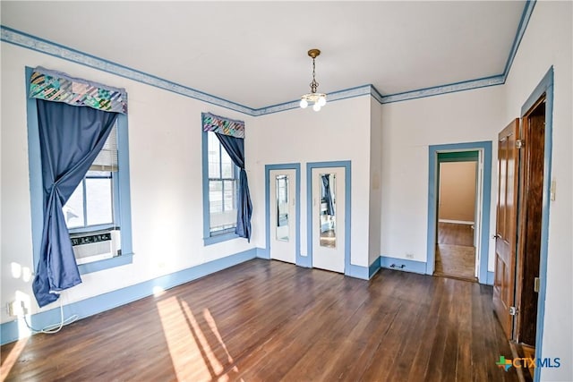 unfurnished room featuring crown molding and dark hardwood / wood-style floors