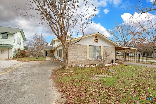 view of property exterior featuring a carport