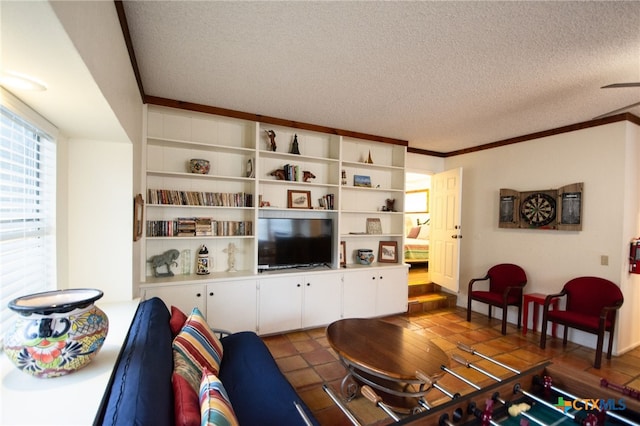 living room with crown molding and a textured ceiling