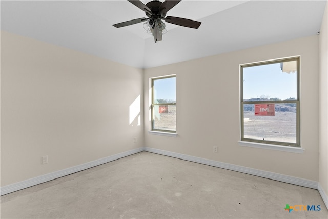 spare room with ceiling fan and lofted ceiling